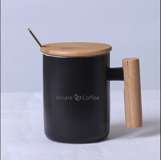 Black mug with bamboo handle, bamboo lid, and metal stirrer